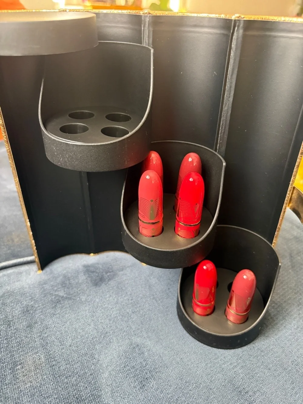 Gold mini Lipstick Organizer Display with a few brand new Lipstick